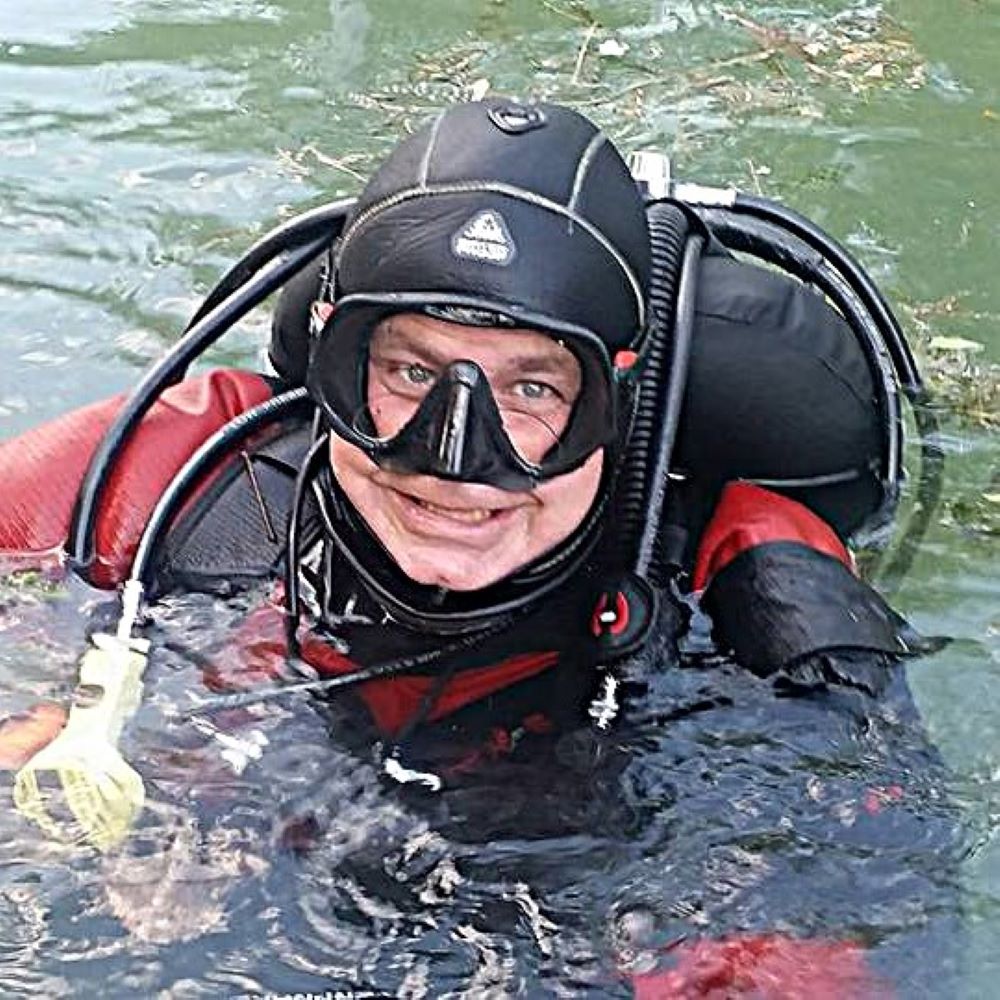 New scuba student smiling in gear