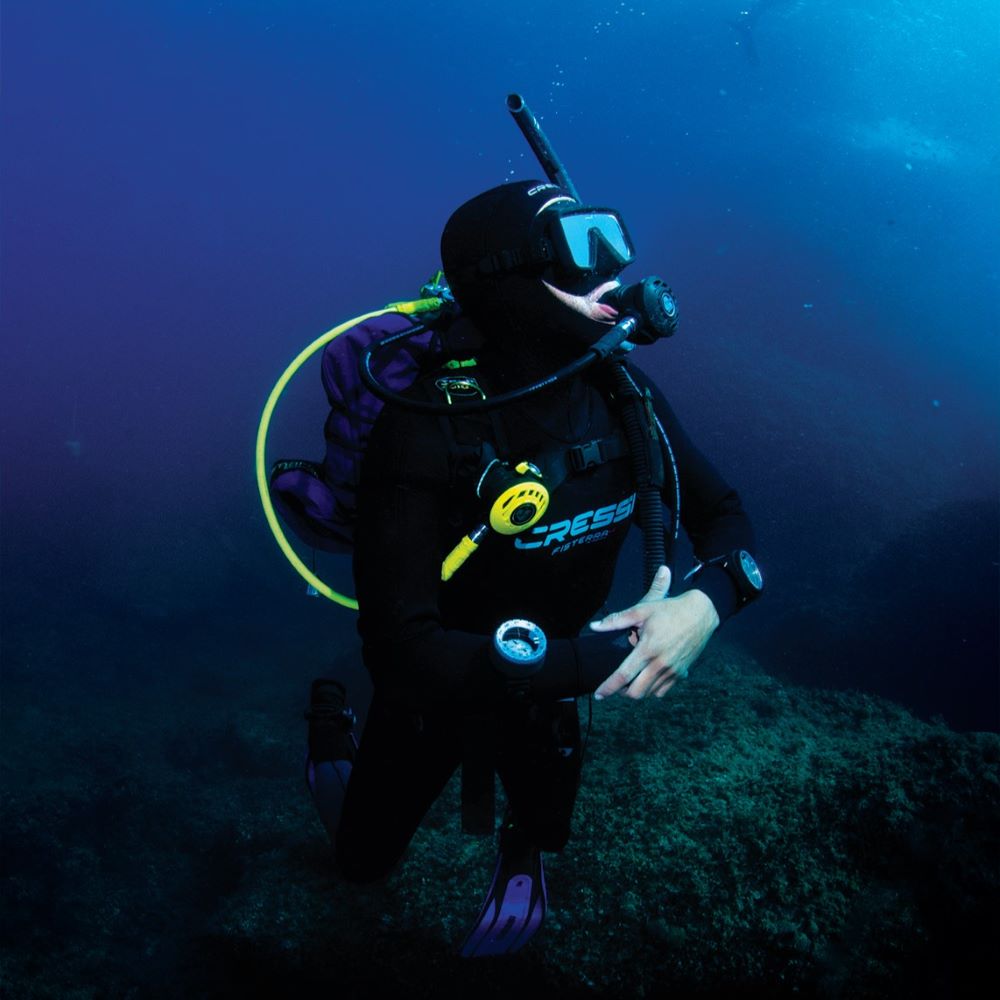 Instructor helping with scuba setup